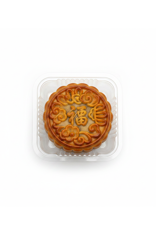 A single golden-brown mooncake in a clear plastic clamshell container, centered on a plain white background.