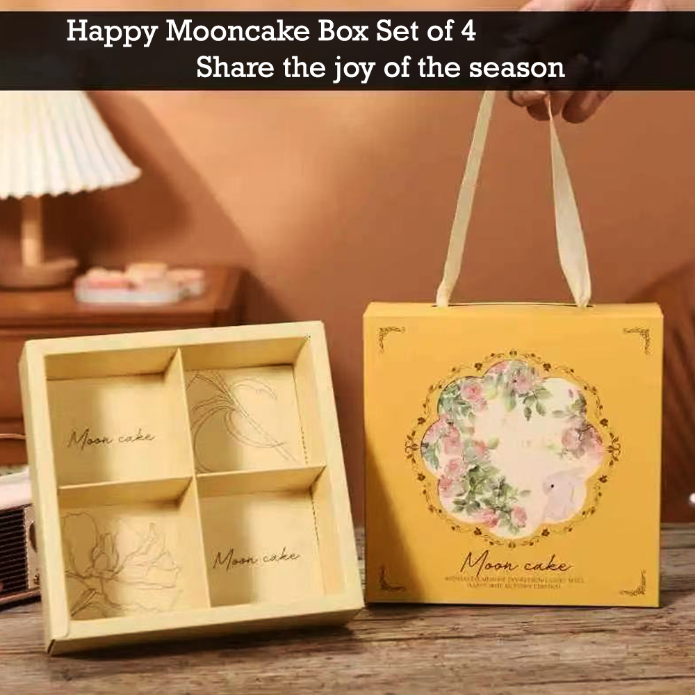 A yellow mooncake gift box set with a floral illustration and the words 'Moon cake' on the front, shown next to an open four-compartment inner box. A hand holds one of the cream-colored handles.
