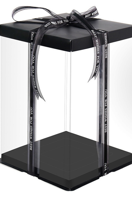 Black gift box with clear lid and ribbon on a white background